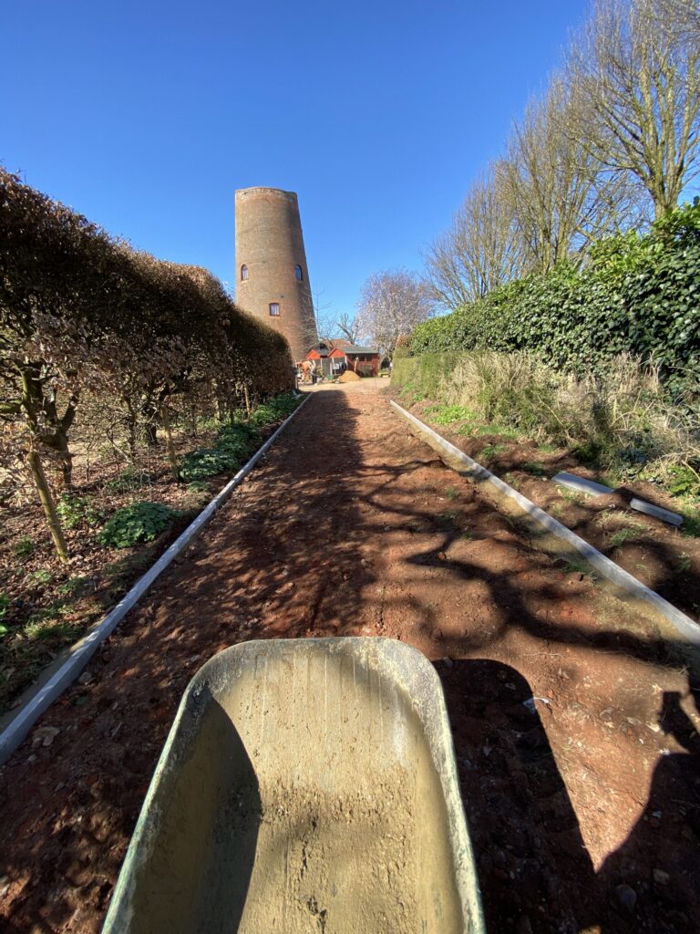 Private road construction at aylsham windmill, norfolk. new kerbs in concrete and hardcore base, ready asphalt