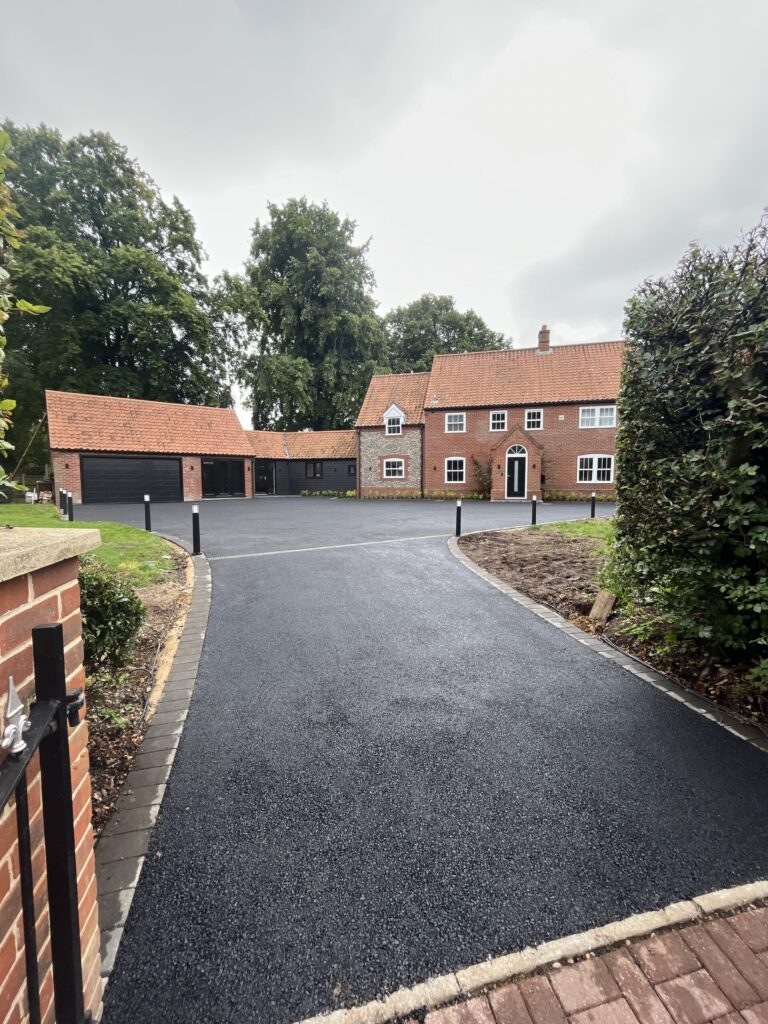 aesthetic tarmac driveway on a country house finished in plain black