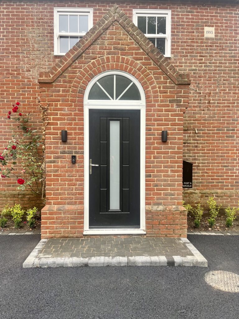 New charcoal front step brick weaved. on a black tarmac driveway in brisley, norfolk