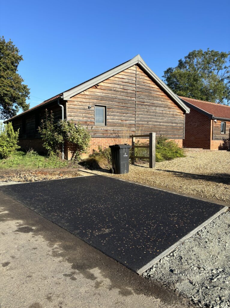tarmac entrance splay to driveway on a sunny day on a rural property