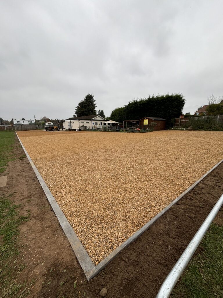 large gravel car park in norfolk at a village hall