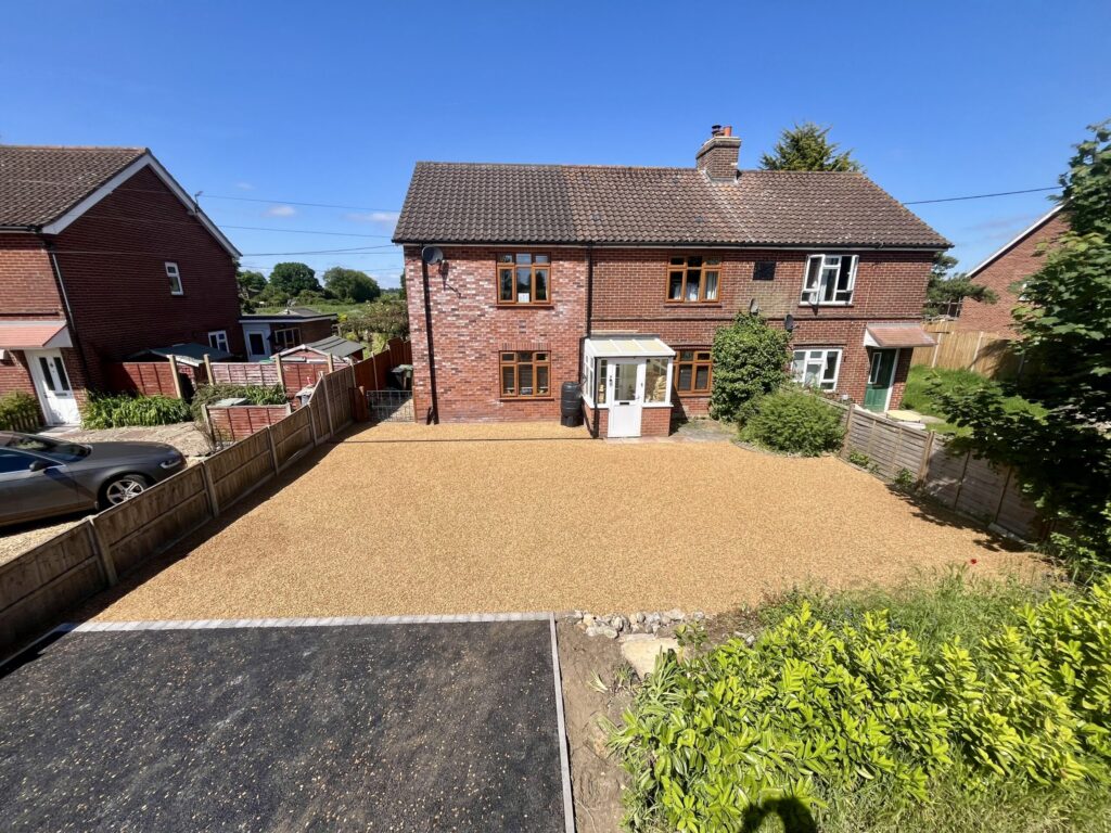 House with a tar and chip driveway with a tarmac entrance splay